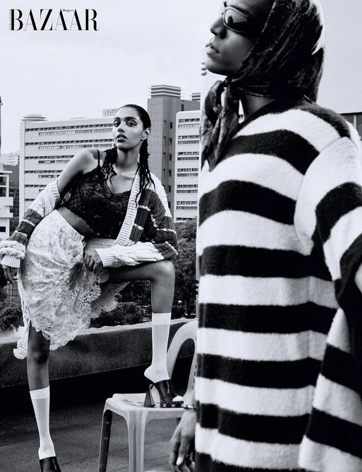 Cardigan; camisole; skirt; sandals, Gucci. Socks (worn throughout, unless stated otherwise), stylist’s own. (On him) Sweater; shorts, Gucci. Sunglasses, Dolce&Gabbana. Scarf; jewellery, model’s own