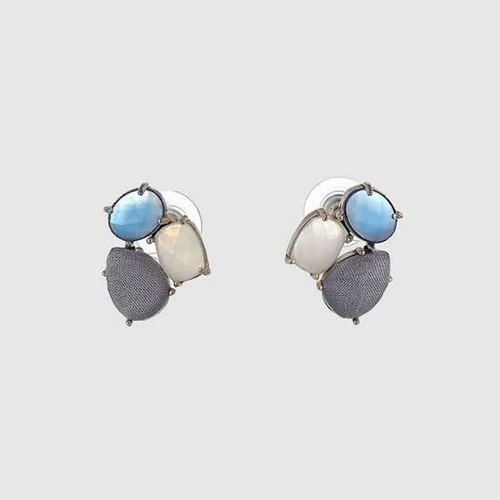 An international flight is not the time to test out your new statement necklace. Not only will it ensure security is a hassle, but depending on your destination, it could also make you a target for thieves. That said, there's no need to completely forgo the sparkle. Opt for smaller earrings like these periwinkle studs by Mignonne Gavigan, and minimal rings.