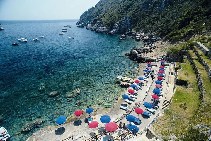 The glamour of Slim Arons’ poolside photography is immortalized at Il Pelicano. Pictures of stylish jetsetters sprawled across its rocky shoreline are featured heavily in his legendary 1974 book, A Wonderful Time, which showcases the rich and famous at play.

The hotel, which is located in Porto Ercole, has hosted the Missoni family, European royalty, and icons from a bygone era: Charlie Chaplin, Henry Fonda, and Gianni Agnelli, to name a few. Trust us: vintage seaside charm never looked so chic. Photo: Slim Arons