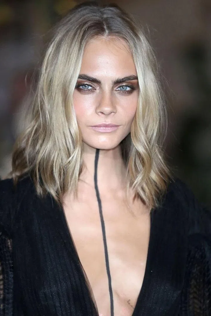 If your hair is naturally wavy, just mist it all-over with a texturizing spray and curl a few face-framing pieces way from your face. 