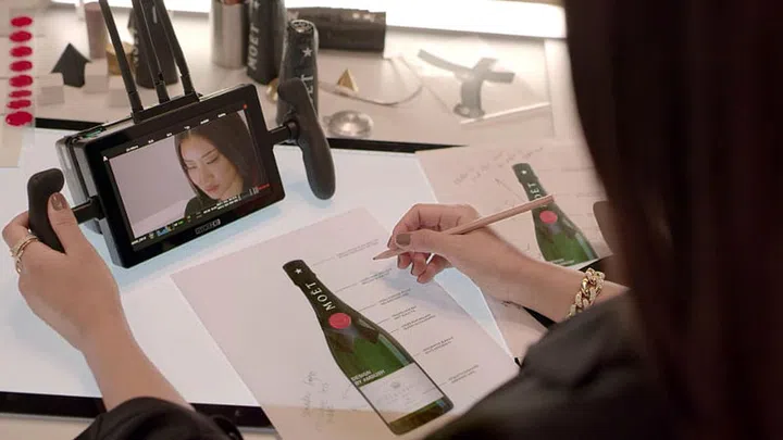Yoon putting the finishing touches on her design for Moët & Chandon's iconic Moët Impérial bottle