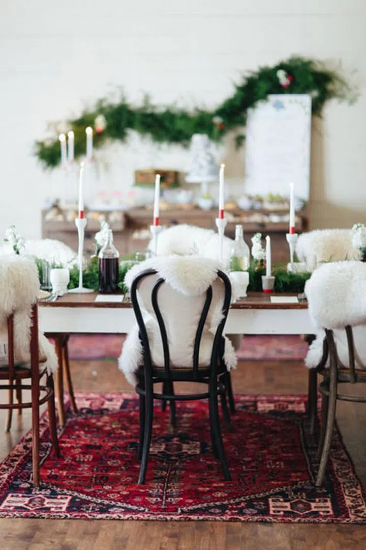 Add some fur throws to your dining room scene to keep things cozy and feeling luxe.