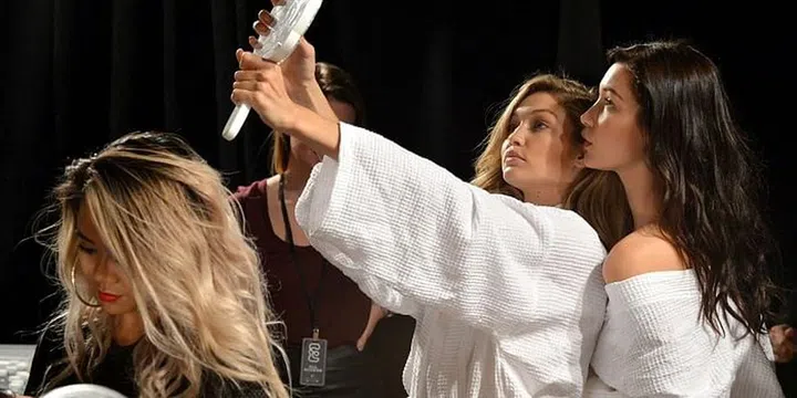 Prepping backstage at the Balmain x H&M Collection Launch. Photo: Getty 