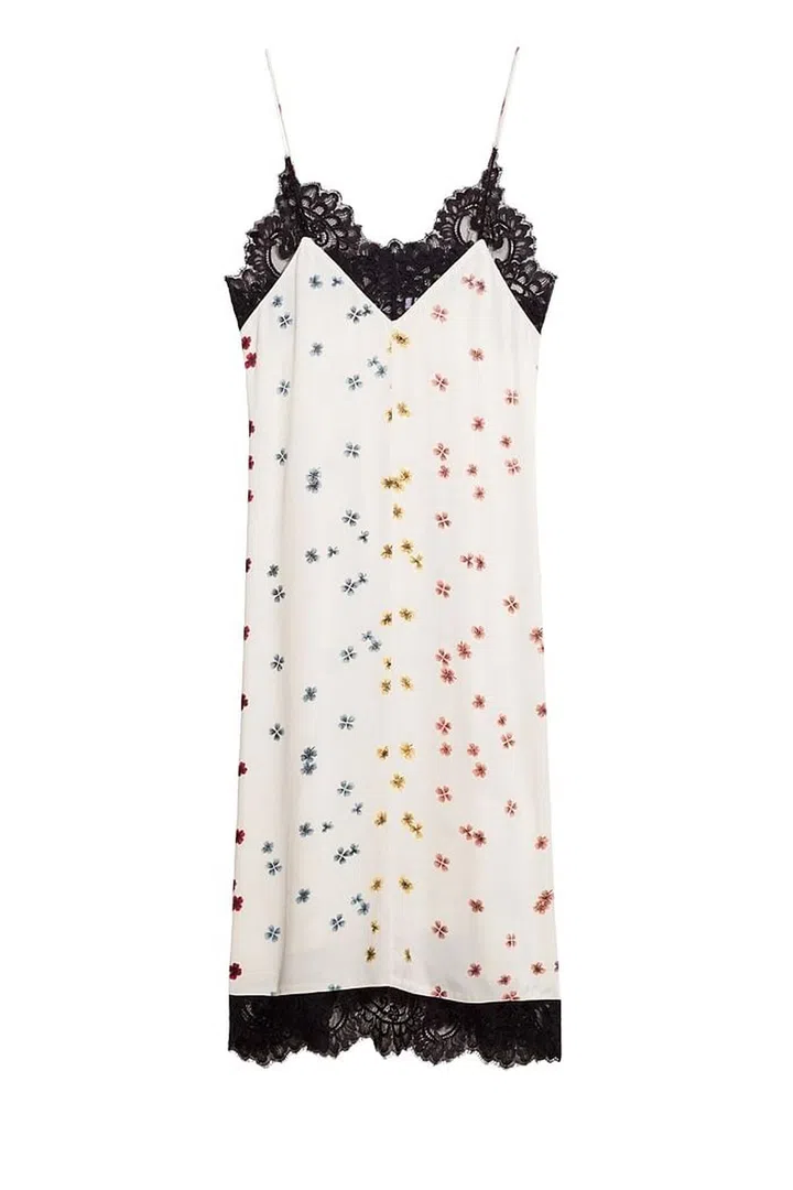 Team a slip dress with a grey T-shirt and utility boots. The delicate clover print adds a feminine charm.