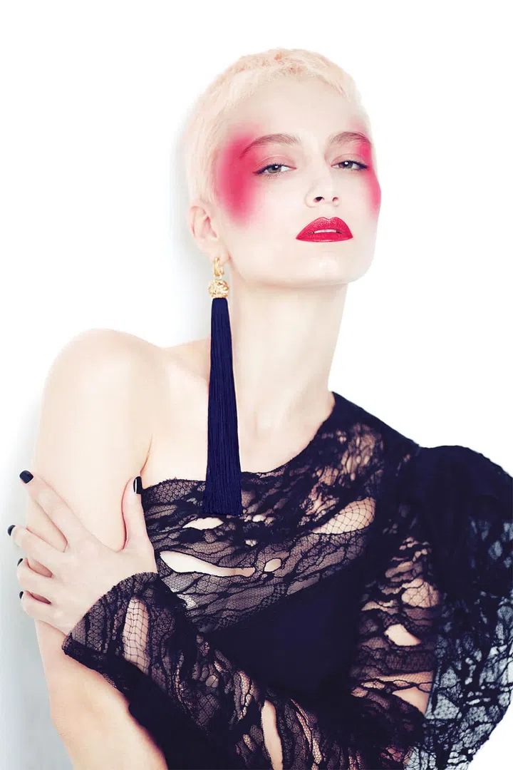 Reminiscent of the glamorous ’70s, this bold and unapologetic look is perfect for a sultry night out. Apply NARS’ Blush in Exhibit A, $50, directly on the temples and blend towards the top of your cheekbones and brow bones to create a C-shape that brings out your bone structure. Skip the liner and illuminate your eyes with Dior’s Flash Luminizer Radiance Booster Pen on the inner corners for a fresh take on this Grace Jones-inspired look. Finish with a slick of NARS’ Velvet Lip Glide in Mineshaft, $40, for a vibrant pout.

Dress; earring, Saint Laurent by Anthony Vaccarello 