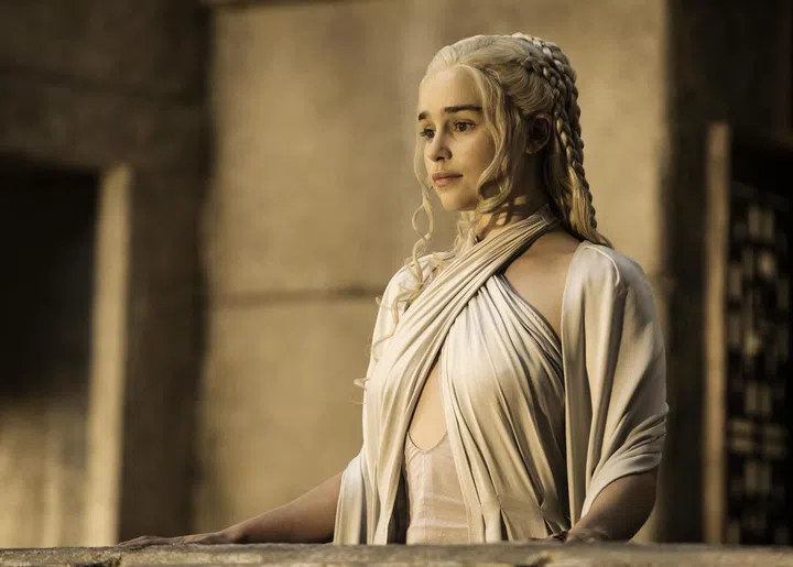 Daenerys' elegant, head of half braids demand attention while showing off the elegance of the Khaleesi