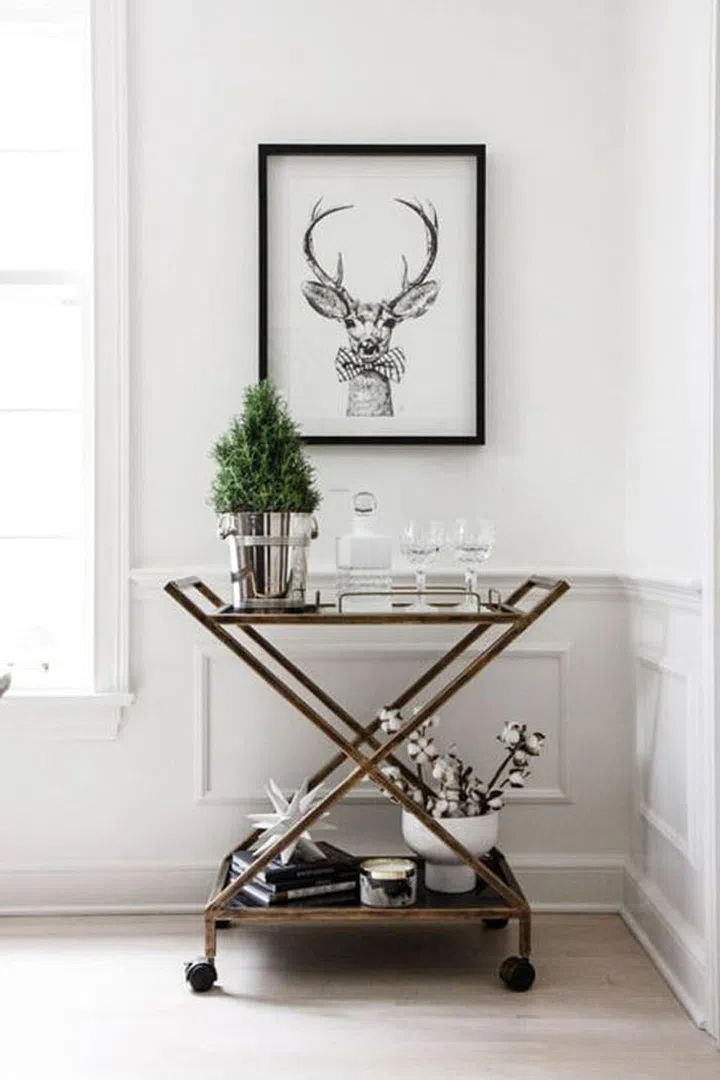 Swap out a few of your favorite art pieces with ones that tap the winter season and bring about some holiday flair.