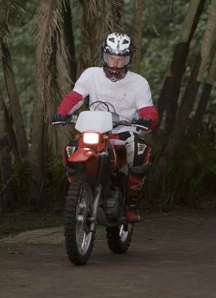Please enjoy this photo of Harry on a motorcycle in South Africa circa 2008, like some sort of brooding Hells Angels member instead of, ya know, an extremely posh royal Prince.