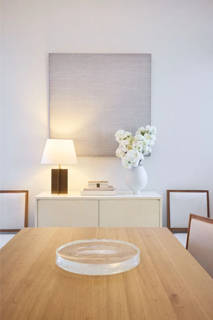 Andre Wu's dining area featuring a painting by Zhou Yangming, a Jean-Michel Frank lamp by Ecart, a Jean-Michael Frank box, a Clarissa Berning Meniscus bowl, and custom-made chairs and cabinet.