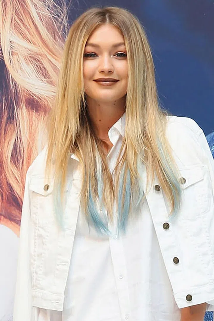 Brown lipstick and teal hair? Come on, that's just fun. Photo: Getty
