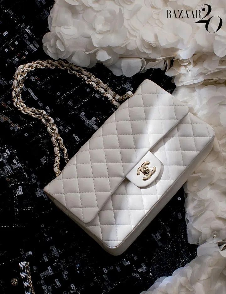 Quilted lambskin 11.12 bag; embroidered tweed jacket; embroidered silk-organza jacket, all by Chanel. (Photo: Ching) 