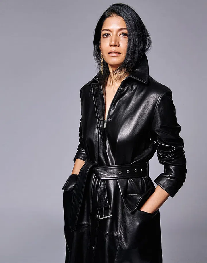 Muthiah wears her own
Dior trench coat.
Gold HardWear Graduated
Link earring, Tiffany & Co.