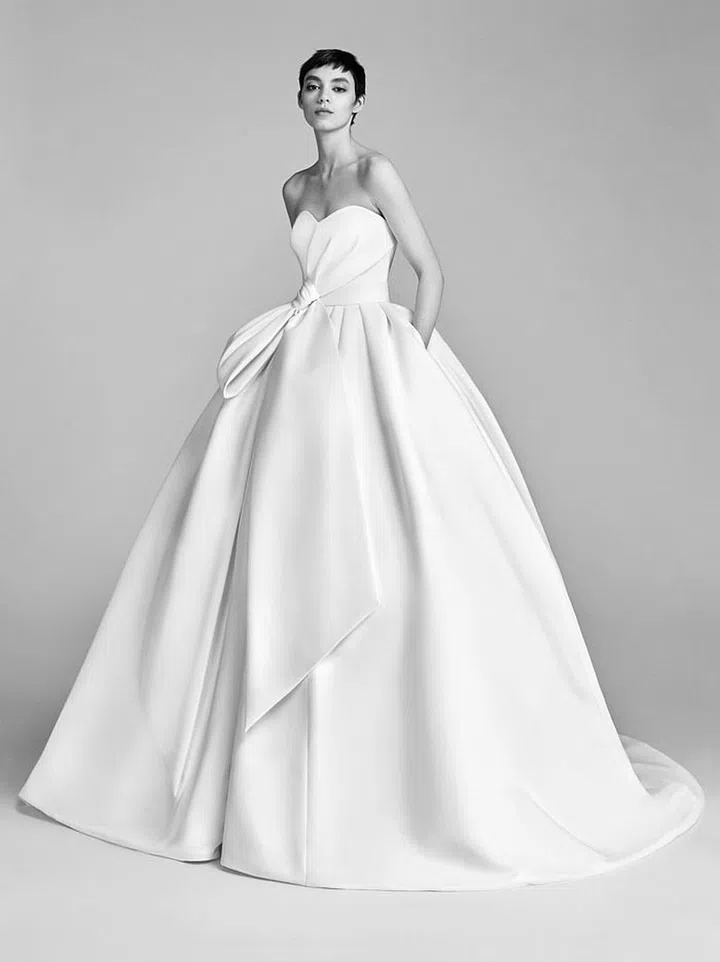 Simple, unadorned yet dramatic shapes feel at home in vast, stunning settings, Viktor & Rolf bow drape ball gown, viktor-rolf.com.