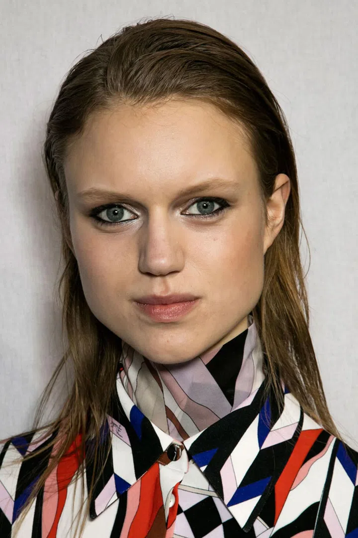 The make-up artist Diane Kendal created graphic eyes, with the liner only going as far as the middle of the upper lid. For the hair, Paul Hanlon added texture to create a 'day-old' finish and pulled it off the face.
