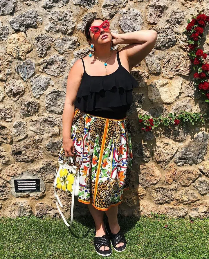 Normally when you think of tailoring a garment, you think to size it down—but you can also have something tailored up. On a recent trip to Dolce &amp; Gabbana, I fell in love with a skirt but the largest size ended up being a smidgen too tight in the waist. As a solution, they offered to tailor the skirt up for me.

Pardon?! This is a thing? After some research, I discovered that many other luxury retailers, such as Chanel, Etro, Gucci, Louis Vuitton, Saint Laurent, and occasionally Prada, offer the same service of letting garments out to make them bigger or adding fabric and elastic to accommodate the shopper's size. Don't be afraid to ask!
Photo: Katie Sturino
