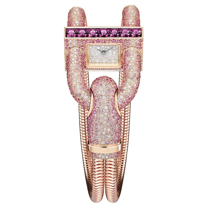 It’s hard to imagine an era when looking at the
time in public was considered inappropriate for
women. It was the height of bad manners in the early 20th century—explaining why Van Cleef and Arpel’s Cadenas watch, with its padlock-inspired shape, is so
cleverly hidden from the view of onlookers. This new edition, with snow-set diamonds and sapphires graduating from pink to white, is as much a head-turning timepiece as it is an endearing artefact of history’s social quirks.