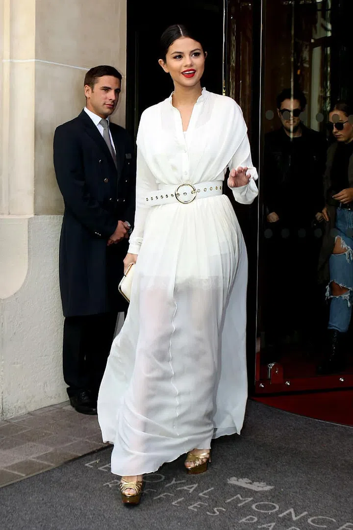 How to: As a long, flowy shirt dress. The languid silhouette conveys a feminine charm, alluring people effortlessly. (Photo: Getty)