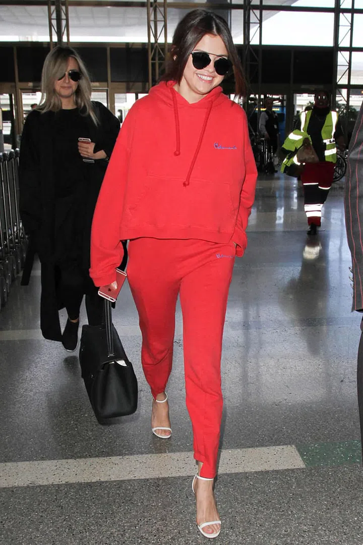 It's an obvious one. If you're dressed from head to toe in one colour, you won't be breaking up your body and will inevitably look taller than if you chop yourself in two by wearing more than one hue.
Photo: Getty
