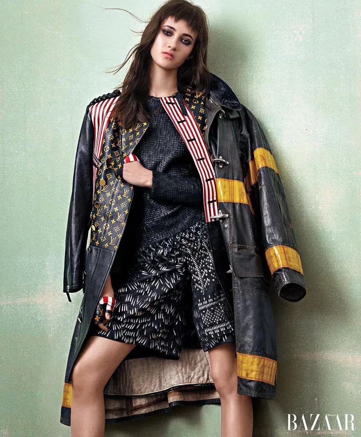 Louis Vuitton coat, top, kilt, shorts, and straps.