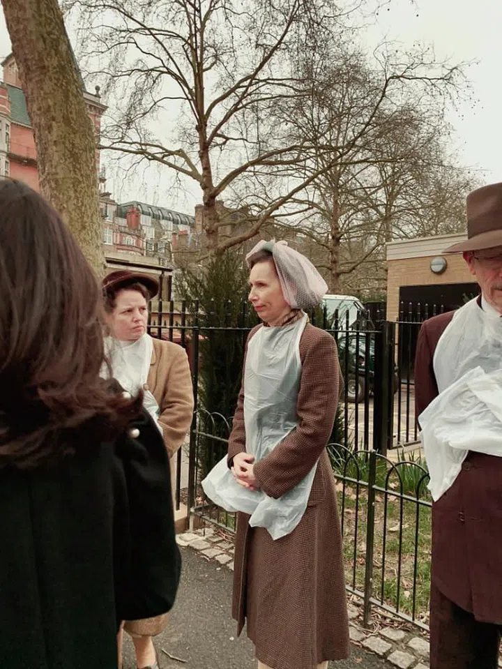 En route to the Molly Goddard show, we stumbled upon the cast of a film shoot taking a break. How chic were their post-war outfits?