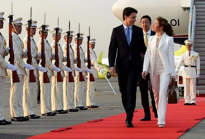 Greeted by an honour guard as they arrive in Tokyo, Japan. Photo: Getty