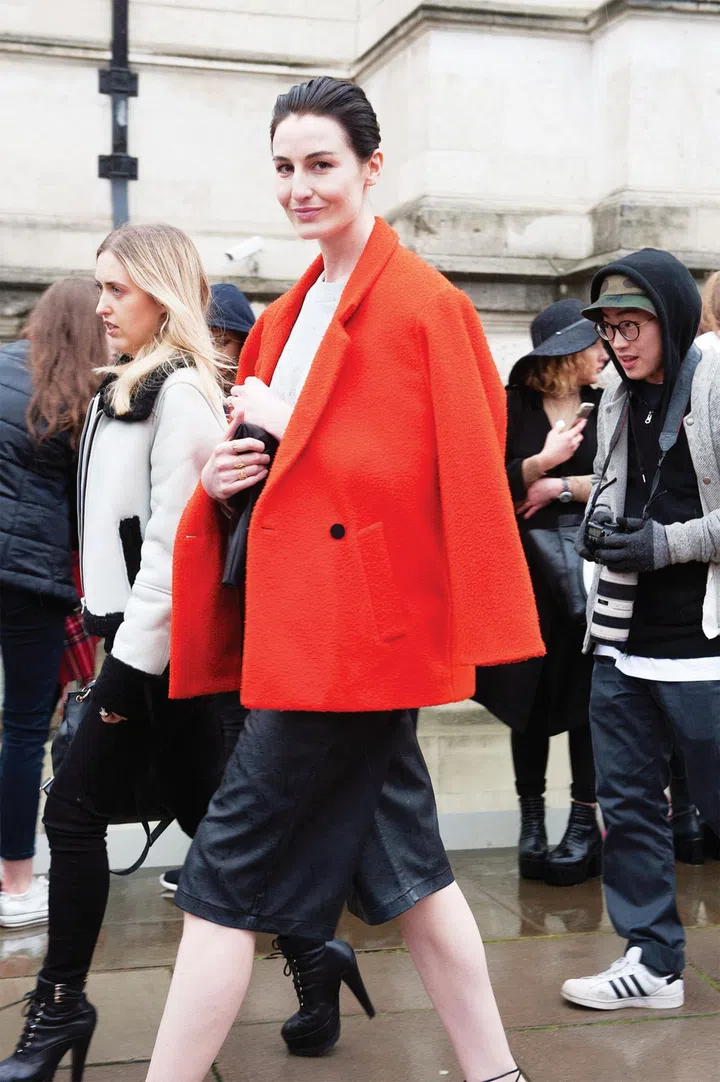 A burst of orange turns heads, as seen at Milan Fashion Week 