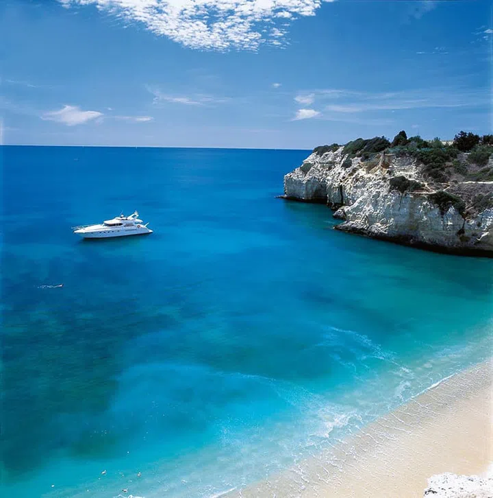 Portugal’s Algarve Coast has been a popular destination for travelers seeking sun, sea, and sand for decades. The dramatic coastline has all of the qualities of the Cote d’Azur, without the crowds and mass tourism, making it an appealing spot for celebrities seeking a relaxing hideaway.

Vila Vita Parc is one of the region’s most beautiful seaside resorts that has been favored by celebrities, politicians, and sports stars since it opened in 1990. The resort boasts panoramic views, gardens brimming with palm trees, and a stunning private beach. The villa is regularly modernized with chic interiors, Michelin-star restaurants, and activities like private wine tours and boat cruises around the coast.