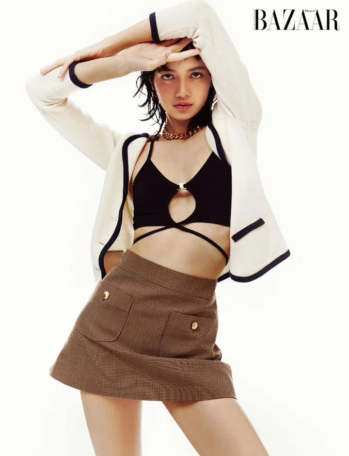 Cardigan; top; skirt; necklace, CELINE. Photo: Dukhwa Jang