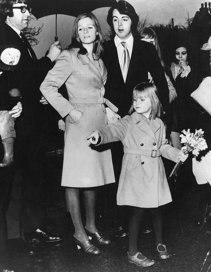 Marrying Paul McCartney in 1969. This is so British, down to the umbrella. 