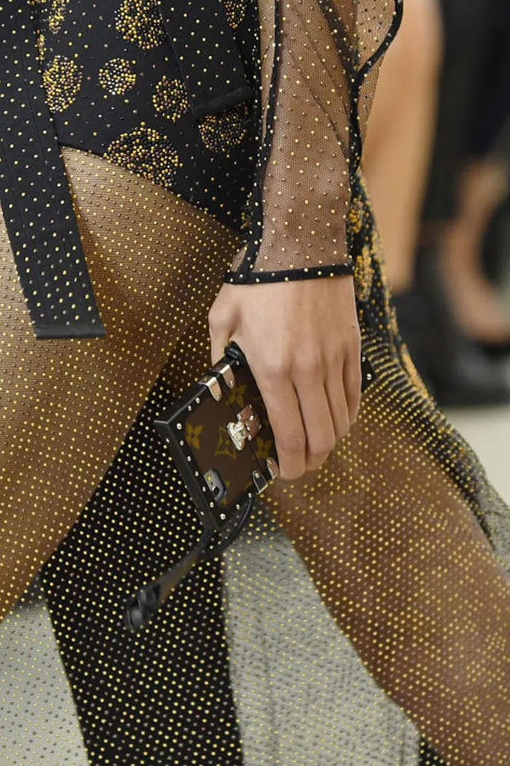 Tiny bags are a big deal for spring/summer 2017, but Louis Vuitton took the idea to the extreme with the tiniest accessory of them all - a logo iPhone case, a guaranteed favourite on the front row.