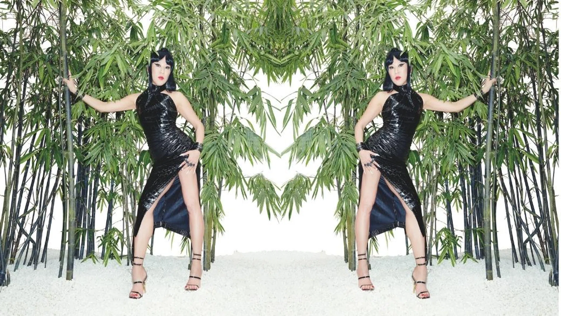 Lynn Ban wears a black dress and sculptural heels from Azzedine Alaia with all jewellery from Lynn Ban collection
