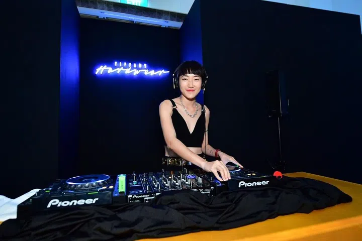 Multi-hyphenate Linda Hao puts aside her pinking shears to deejay for the event
