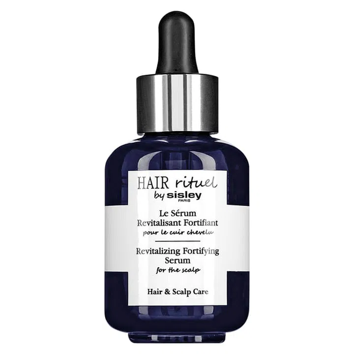 Brimming with plant-based extracts, proteins, minerals and vitamins, this intense cure for the scalp energises, soothes discomfort and strengthens strands. Bonus: Its ultra-light, non-greasy texture is perfect for a scalp massage and it won’t stain your sheets.

Hair Rituel Revitalizing Fortifying Serum (for the scalp), $250, Sisley