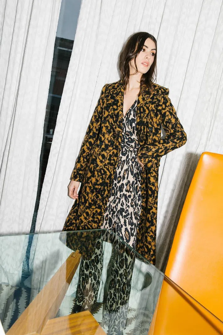 This season, Diane von Furstenberg was focused on simplifying the daily affair of dressing for the professional woman who wears many hats. This manifested in a collection of versatile building block pieces made for easy mixing and matching. Not to be mistaken for basics, these pieces were chock-full of signature DVF zest, with botanical, graffiti-inspired, and colourful paisley prints aplenty.
The collection’s mainstays were easy jersey-silk dresses of the slip, shirt, and wrap variety, and office-ready separates; all designed with smart layering in mind to allow multiple outfits to be put together with the same pieces. For a dose of whimsy, one wrap dress sported a photo print spun together from newspaper clippings about the brand, paying homage to the hallmark silhouette
that heralded von Furstenberg’s arrival in
fashion 45 years ago.