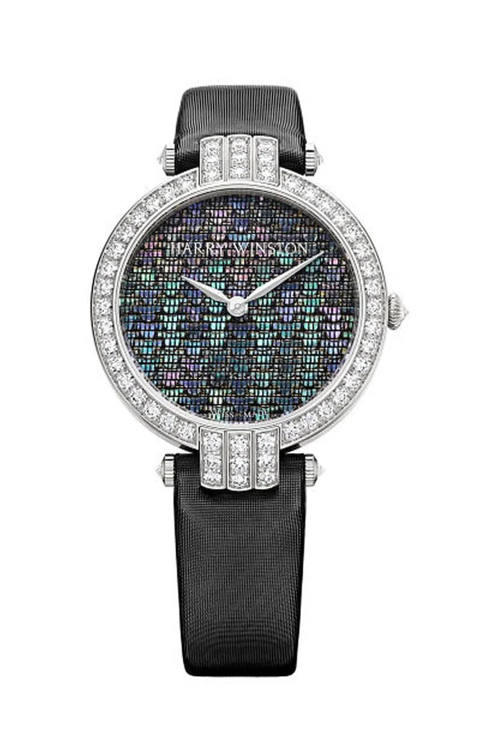 A unique dial inspired by Japanese decorative crafts, the Harry Winston Premier Precious Weaving uses a technique known as Raden in which slivers of mother of pearl are inlaid with gold and silk threads. The time-consuming process results in a woven surface that looks very much like fabric, the threads highlighting the iridescent quality of the shell. The automatic white gold watch features a bezel of sparkling diamonds, highlighting the unique multi-colored three dimensional surface.
Harry Winston Premier Precious Weaving Automatic Timepiece, Price Upon Request, 1-800-988-4110 or harrywinston.com