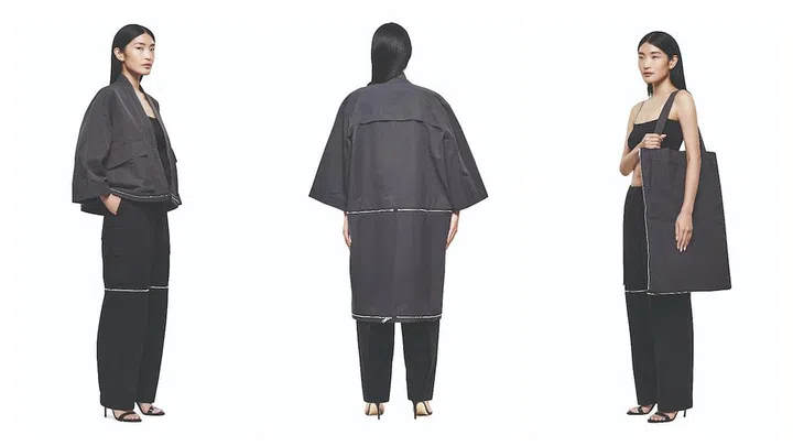 The roomy, well‐tailored coat transforms into
a jacket. Once removed, the bottom panel can then be turned into an oversize tote that’s perfect for your daily necessities and then some. (Photo: Phyllicia Wang)