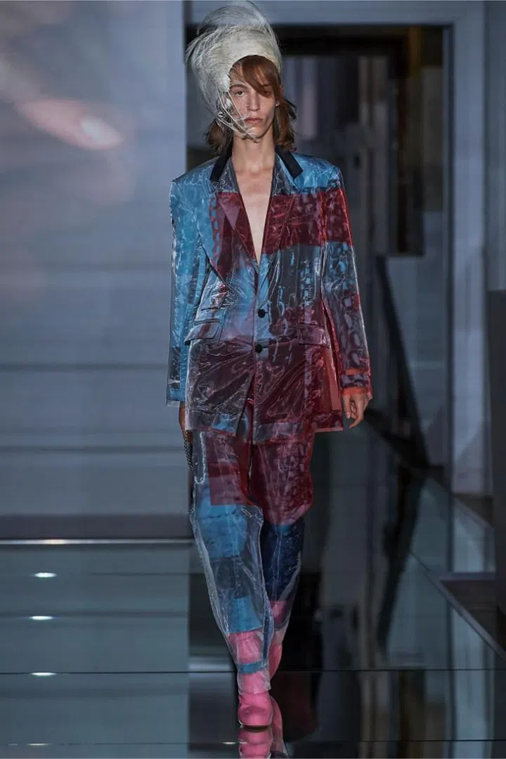 John Galliano had anarchy on his mind. With his latest Artisanal collection, he shattered what remained of the gender binary, sending out boys in shrunken sweaters, hot pants, garter belts and thigh-high boots. He also torpedoed the tropes of couture. The wasp waists and full-skirted looks called to mind the mid-century New Look, but their components and the manner in which they were employed were resolutely of the 21st century. Things were never quite what they seemed. What looked like houndstooth, tweeds and furs were actually prints transferred onto shimmery semi-sheer fabrics then overlaid on wool and mohair, like filters. Lace was alluded to by punching holes into garments. Trousers got cut up and remixed into bustier dresses. A trench coat was twisted into a one-shouldered dress. It was all beautifully chaotic and resulted in a sensory overload—couture for the modern times. 

Photo: Courtesy
