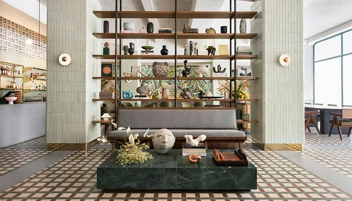 As the Soho House of Singapore, this elite club has a picturesque lobby and a chic cafe (it's public!).  You can either get a shot by the shelf or by a wall mural, which is painted by local artist duo Ripple Root whose mural at Keong Said Road is a tourist attraction.

Photo: Straits Clan
