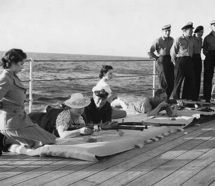 Princess Elizabeth (left) watches her parents partake in ride shooting during a trip to South Africa. Photo: Getty 