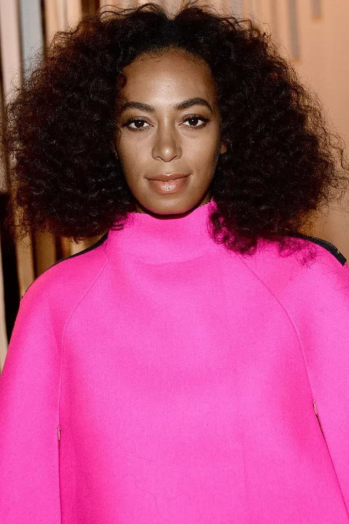 Gorgeous, full natural texture is the only thing needed to stand out from the street style crowd. Photo: Getty