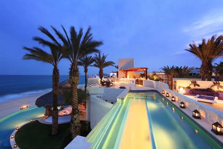 In the newly unveiled 28,000-square-foot Ty Warner Mansion at Las Ventanas Al Paraiso in Cabo San Lucas, guests have private access to two ultra-luxurious pools: a 328-foot long, infinity-edge swimming pool flanking the Sea of Cortez, equipped with dual spas and in-pool living room, and a 40-foot, glass-bottomed lap pool with whirlpool spa, located on the master villa's rooftop terrace. 