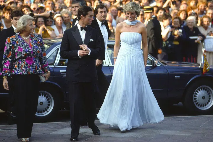In a pale blue chiffon Catherine Walker gown and stole while arriving to Cannes Film Festival with Prince Charles. Photo: Getty