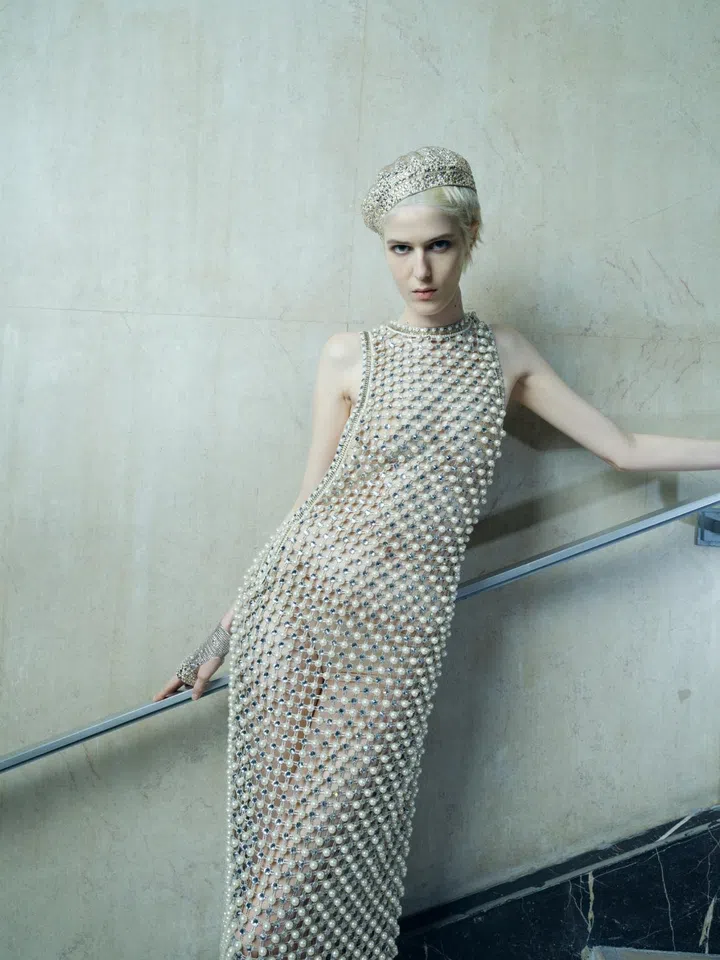 Model wears Armani Privè beaded mesh gown.