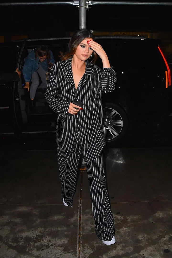 Selena Gomez wears a black pinstripe co-ord set by Leset in Manhattan, New York.

Photo: Robert Kamau/Getty