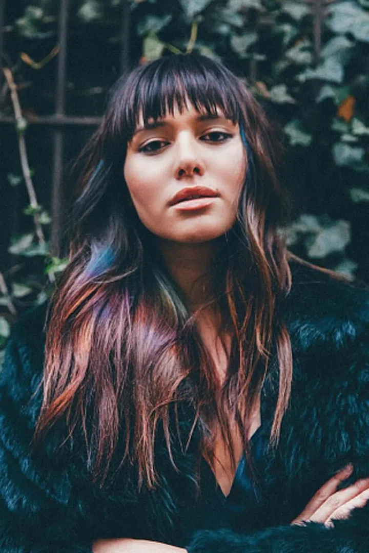 Blogger Natalie Suarez transformed her brunette strands with a rock 'n' roll-inspired, rainbow strobing dye job by Matrix. A head-turning way to add dimension to cool-girl waves, you can also take a more temporary route by using different hair chalks.

Try: Simply Beautiful Hair Chalks (24 Colors), $19.99; amazon.com.