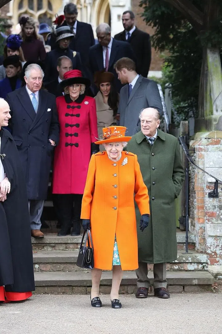 The Queen opted for a bright tangerine coat and matching hat.
