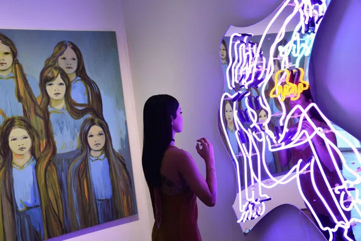 "This neon dancer piece by Mira Dancy drew me in."