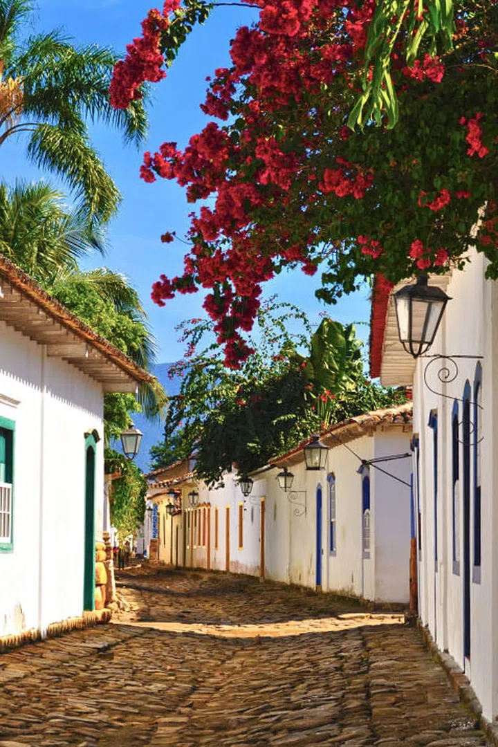 Located halfway between Rio de Janeiro and São Paulo on the lush Costa Verde, the small coastal town of Paraty is known for its beautiful colonial center. The cobblestone streets are closed to car traffic making it an idyllic getaway from Brazil's big cities. Photo: Getty