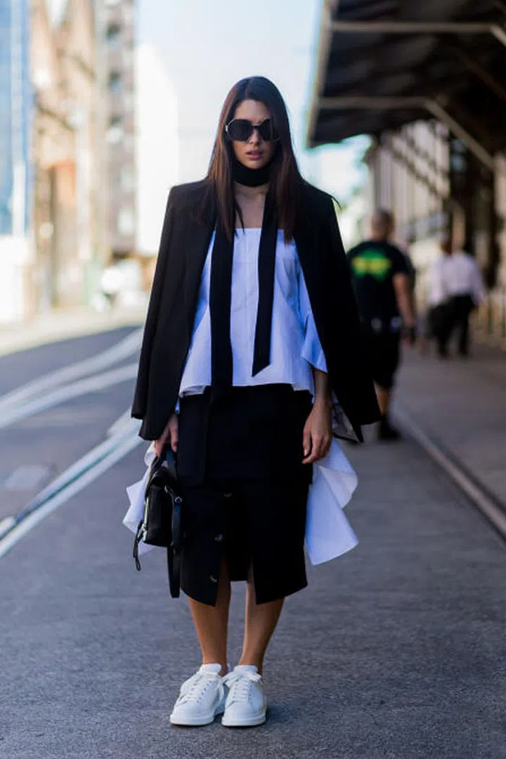 For a sophisticated spin, style your sneaks with structured office-friendly pieces like an oversized blazer and black pencil skirt.
For a sophisticated spin, style your sneaks with structured office-friendly pieces like an oversized blazer and black pencil skirt.Photo:Getty