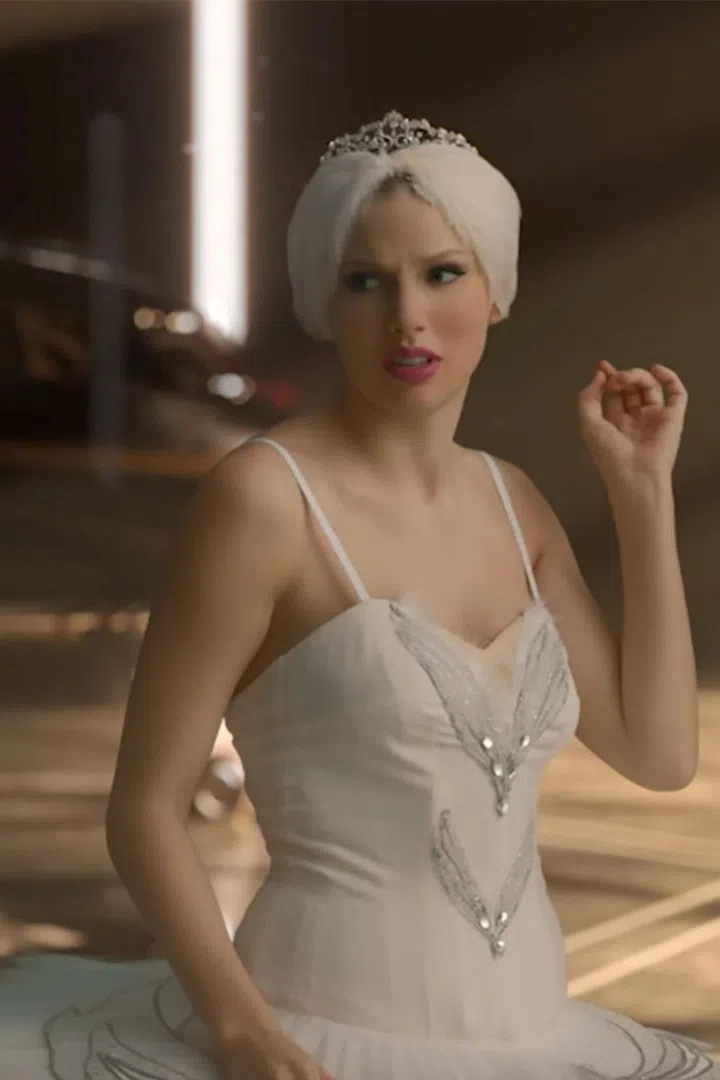 Blossoming from an already beautiful swan into another already beautiful swan, Taylor recaptures the rosy cheeks and feathery headpiece of 2014's "Shake It Off." Except, of course, for the whole "shaking off" thing. That Taylor can't come to the phone right now. 